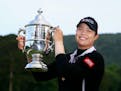 FILE - In this June 3, 2018, file photo, Ariya Jutanugarn, of Thailand, holds up the trophy after winning in a four hole playoff during the final roun