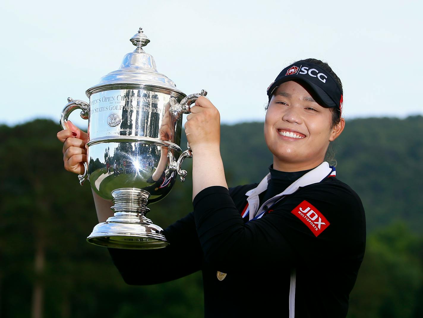 FILE - In this June 3, 2018, file photo, Ariya Jutanugarn, of Thailand, holds up the trophy after winning in a four hole playoff during the final round of the U.S. Women's Open golf tournament at Shoal Creek, in Birmingham, Ala. Jutanugarn is already the LPGA's player of the year and leading moneywinner this season. She'll look to cap the season with a win in the CME Group Tour Championship that begins Thursday, Nov. 15. (AP Photo/Butch Dill, File)