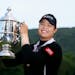 FILE - In this June 3, 2018, file photo, Ariya Jutanugarn, of Thailand, holds up the trophy after winning in a four hole playoff during the final roun