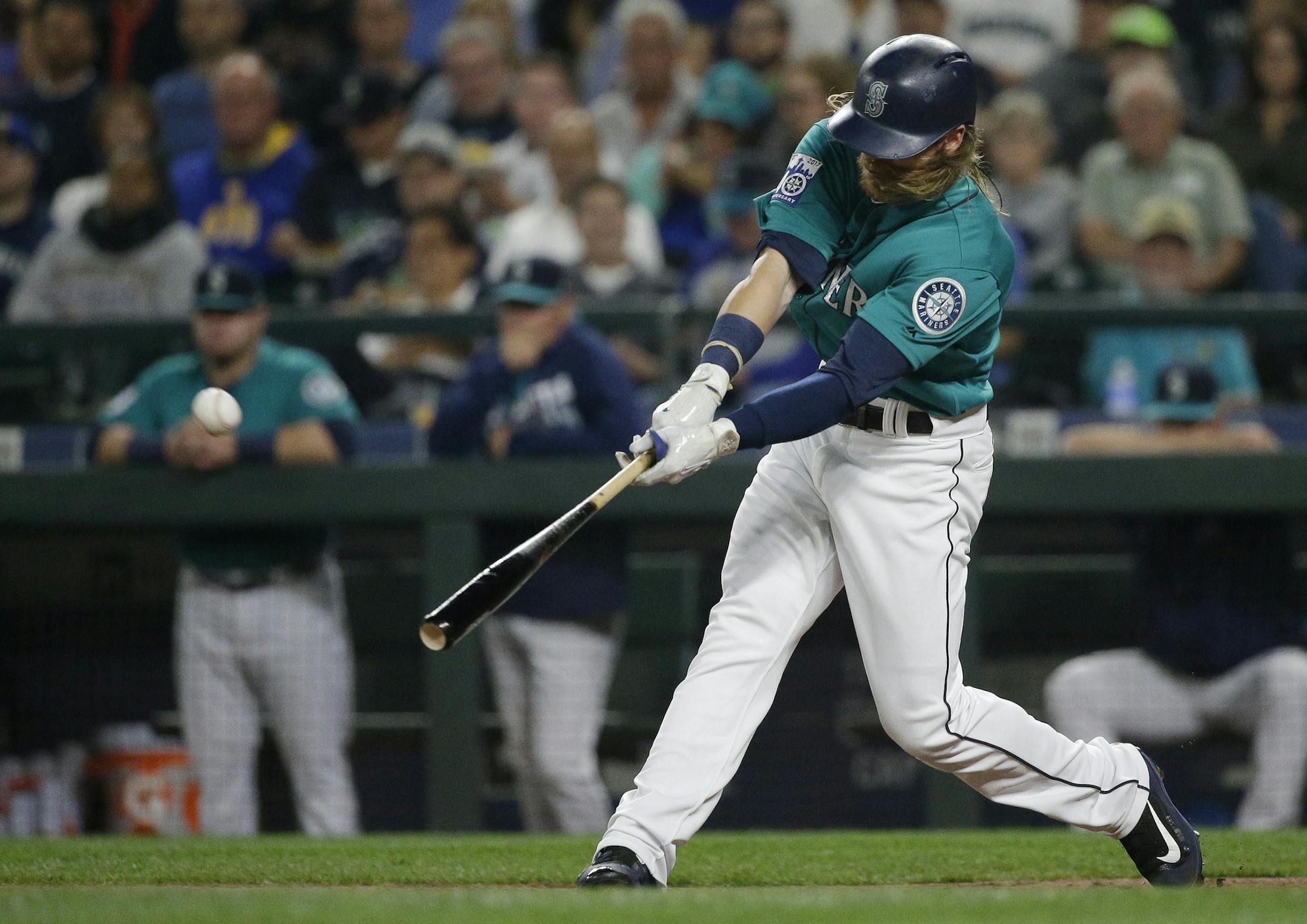 Seattle Mariners' Ben Gamel hits a three-run home run against the Los Angeles Angels during the second inning of a baseball game, Friday, Sept. 8, 2017, in Seattle. (AP Photo/Ted S. Warren)