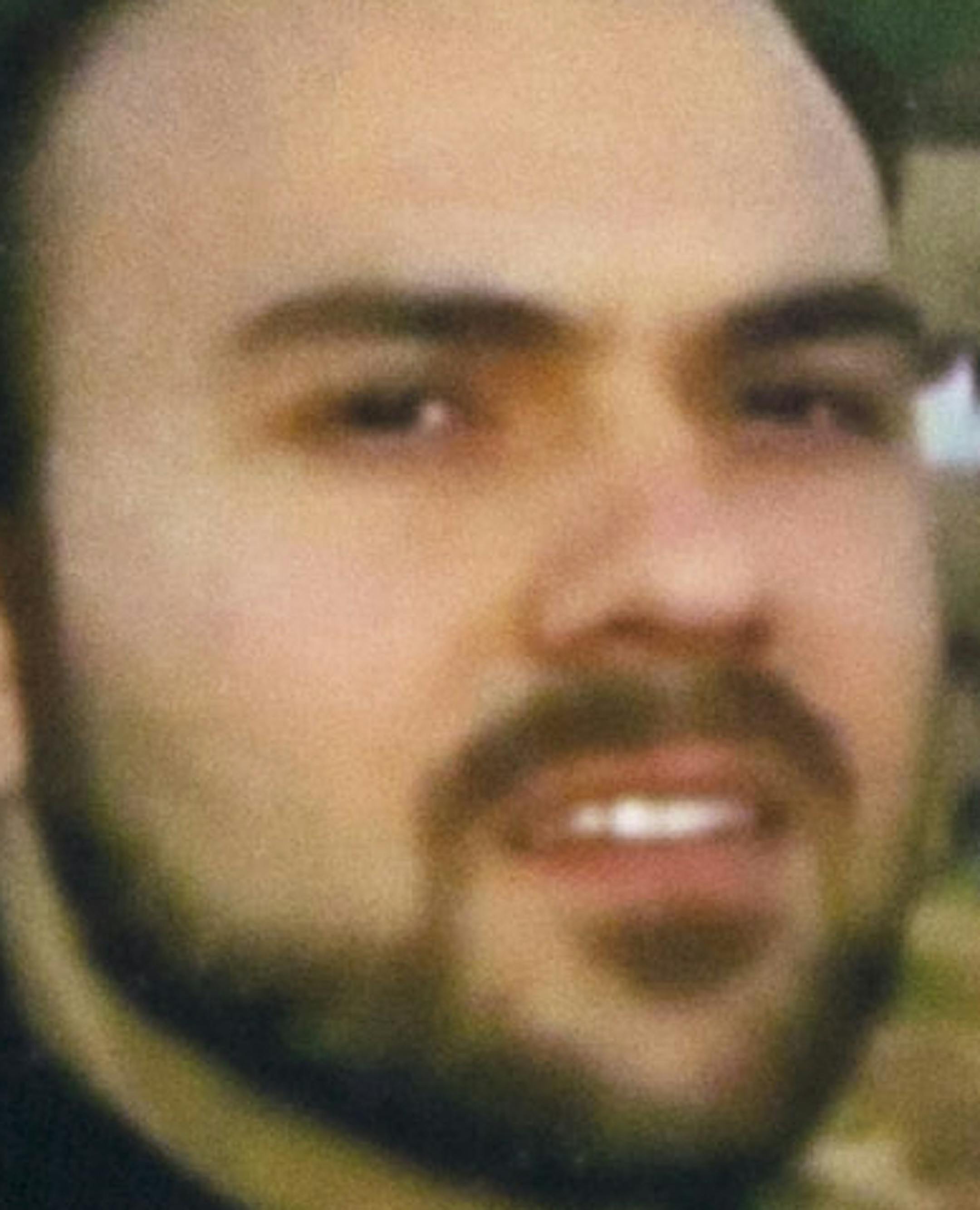 FILE - In this June 2, 2015 file photo, Naghmeh Abedini holds a necklace with a photograph of her husband, Saeed Abedini, on Capitol Hill in Washington. Iran state television has reported that the government has released several dual-national prisoners. The Associated Press has confirmed that three of them were Washington Post reporter Jason Rezaian, former U.S. Marine Amir Hekmati and pastor Saeed Abedini. (AP Photo/Jacquelyn Martin, File)