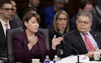 Sens. Amy Klobuchar and Al Franken question the Republican side as the Senate Judiciary Committee discusses the nomination of Supreme Court nominee Ne