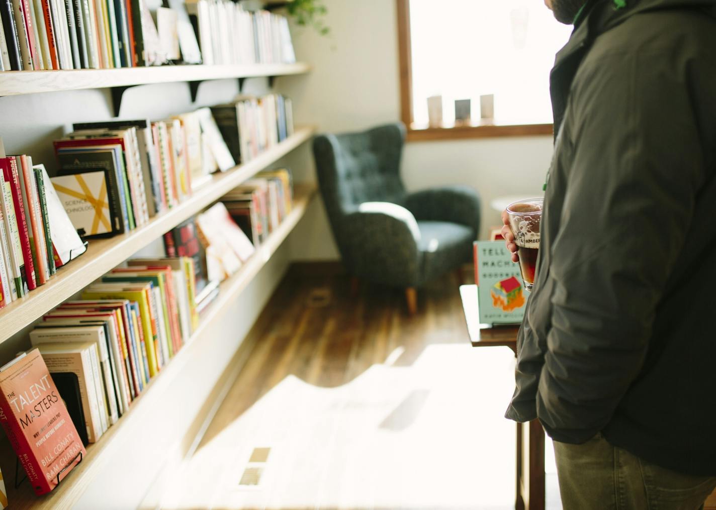 At Cream and Amber bookstore in Hopkins, customers can sip a beer while they browse the shelves. Photo by Jessica Holleque