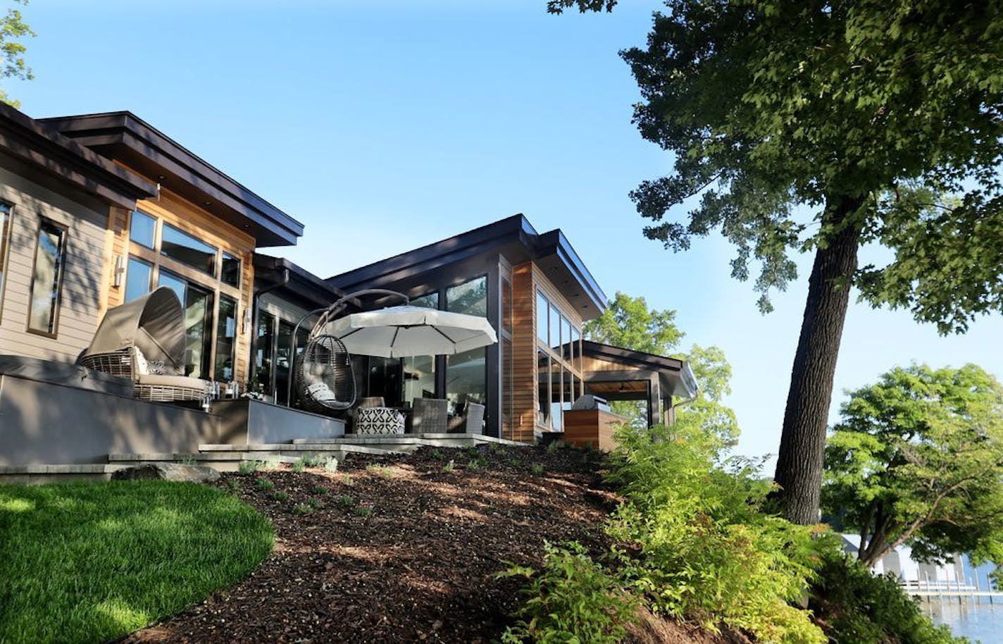 The home sits on a ridge above the lake shore.