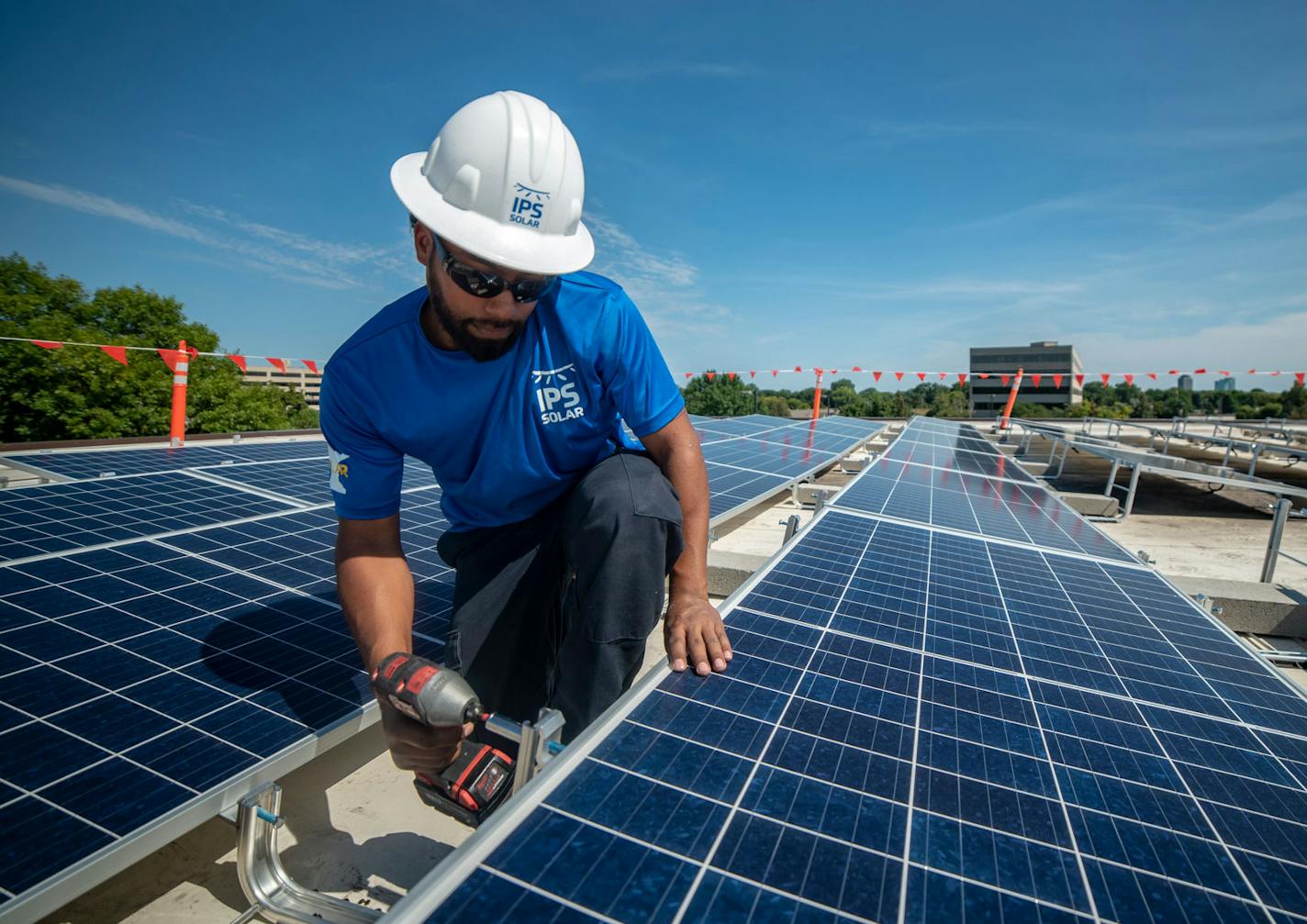 IPS Solar installer Sevion Dalton worked at the Edina Public Works Community Solar Garden in 2019. Photo: IPS Solar