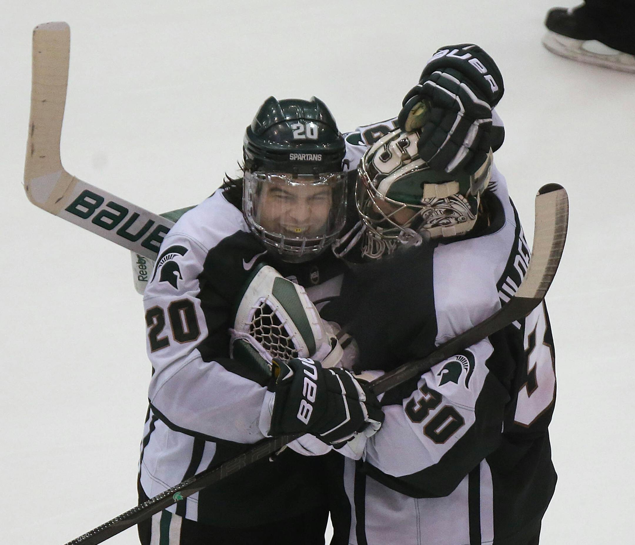 Michigan State players Mike Ferrantino (left) and Jake Hildebrand celebrated after their win in the shootout, which took place after the teams tied, 2-2 in regulation time. ] JIM GEHRZ ‚Ä¢ jgehrz@startribune.com / Minneapolis, MN / January 31, 2014 / 8:00 PM BACKGROUND INFORMATION: The Minnesota Golden Gophers men‚Äôs hockey team played the Michigan State Spartans at Mariucci Arena in Big Ten hockey action.