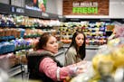 Wendy Rojas and her daughter Krystell, 15, shopped the produce section at the new Burnsville Aldi. ] GLEN STUBBE &#xef; glen.stubbe@startribune.com Fr