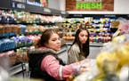 Wendy Rojas and her daughter Krystell, 15, shopped the produce section at the new Burnsville Aldi. ] GLEN STUBBE &#xef; glen.stubbe@startribune.com Fr