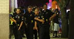 WEB USE BY TNS CONTRIBUTORS ONLY; MANDATORY CREDIT -- Dallas Police respond after shots are fired at a Black Lives Matter rally in downtown Dallas on 