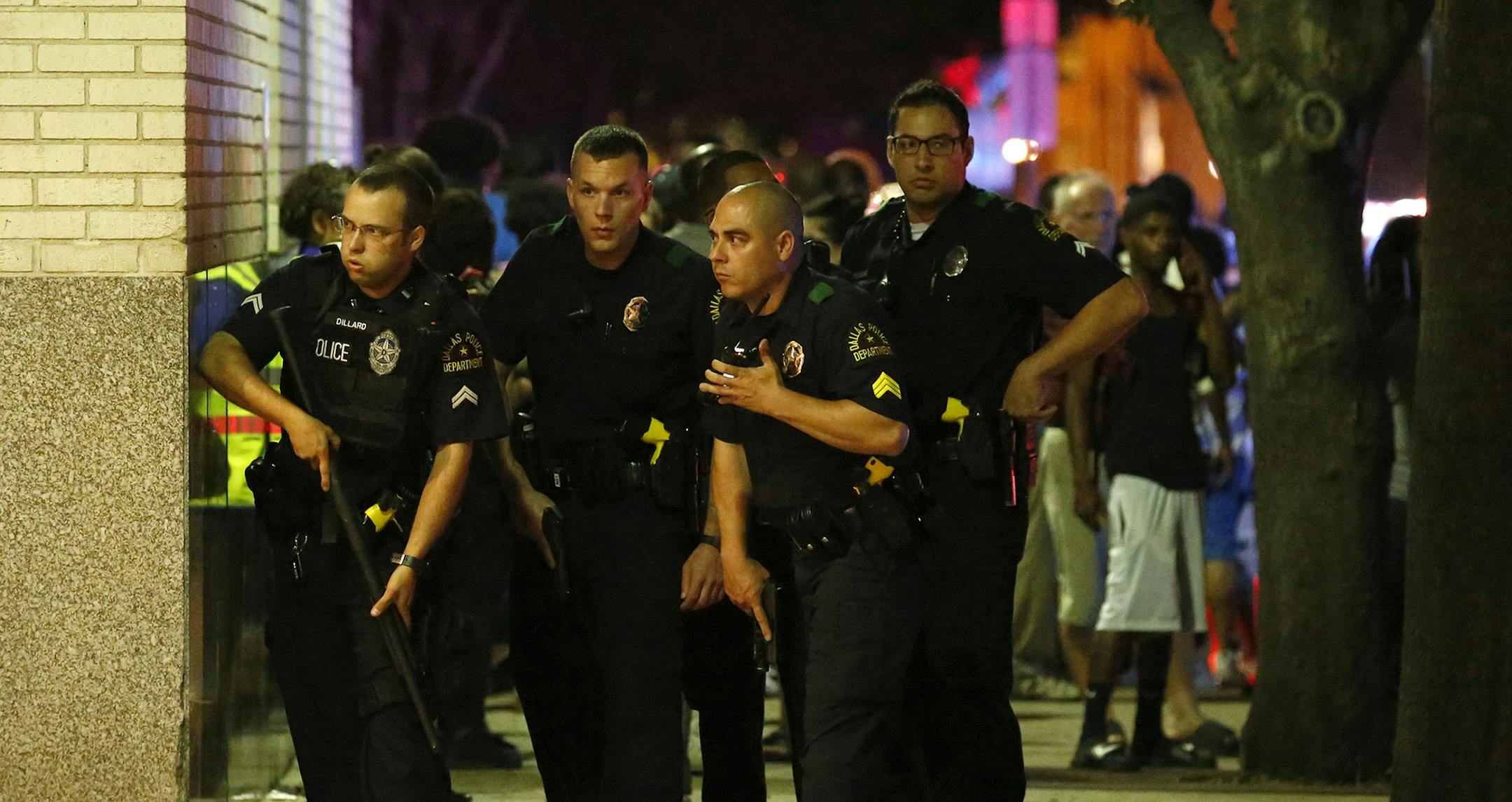 WEB USE BY TNS CONTRIBUTORS ONLY; MANDATORY CREDIT -- Dallas Police respond after shots are fired at a Black Lives Matter rally in downtown Dallas on Thursday, July 7, 2016. Dallas protestors rallied in the aftermath of the killing of Alton Sterling by police officers in Baton Rouge, La., and Philando Castile, who was killed by police less than 48 hours later in Minnesota. (G.J. McCarthy/Dallas Morning News/TNS) ORG XMIT: 1187054 ORG XMIT: MIN1607072342312439