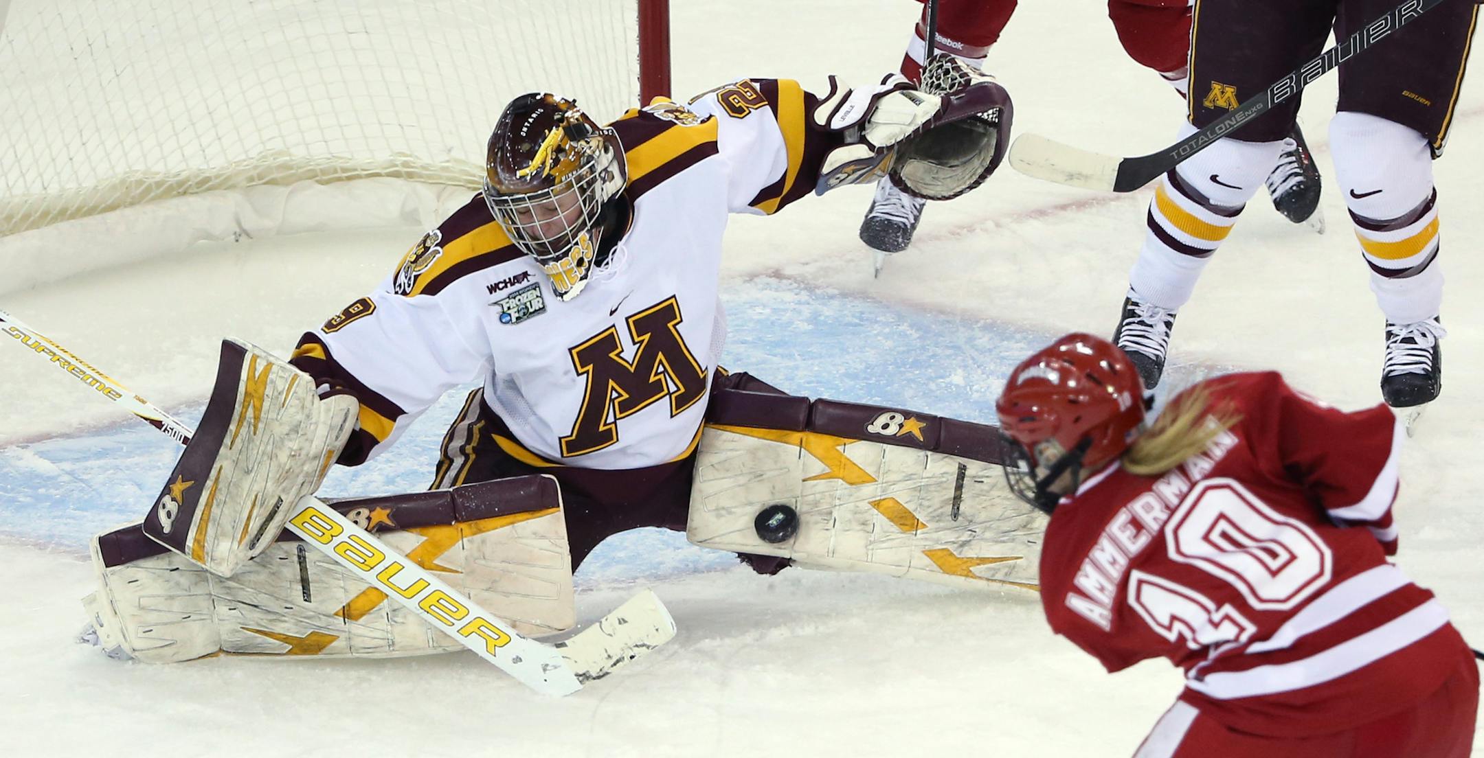 Gopher goalie Amanda Leveille blocked a shot from Wisconsin's Brittany Ammerman during first period. ] (KYNDELL HARKNESS/STAR TRIBUNE) kyndell.harkness@startribune.com Minnesota vs Wisconsin during the semifinals round of the NCAA Women's Frozen Four in Hamden, Conn Friday, March 21, 2014.