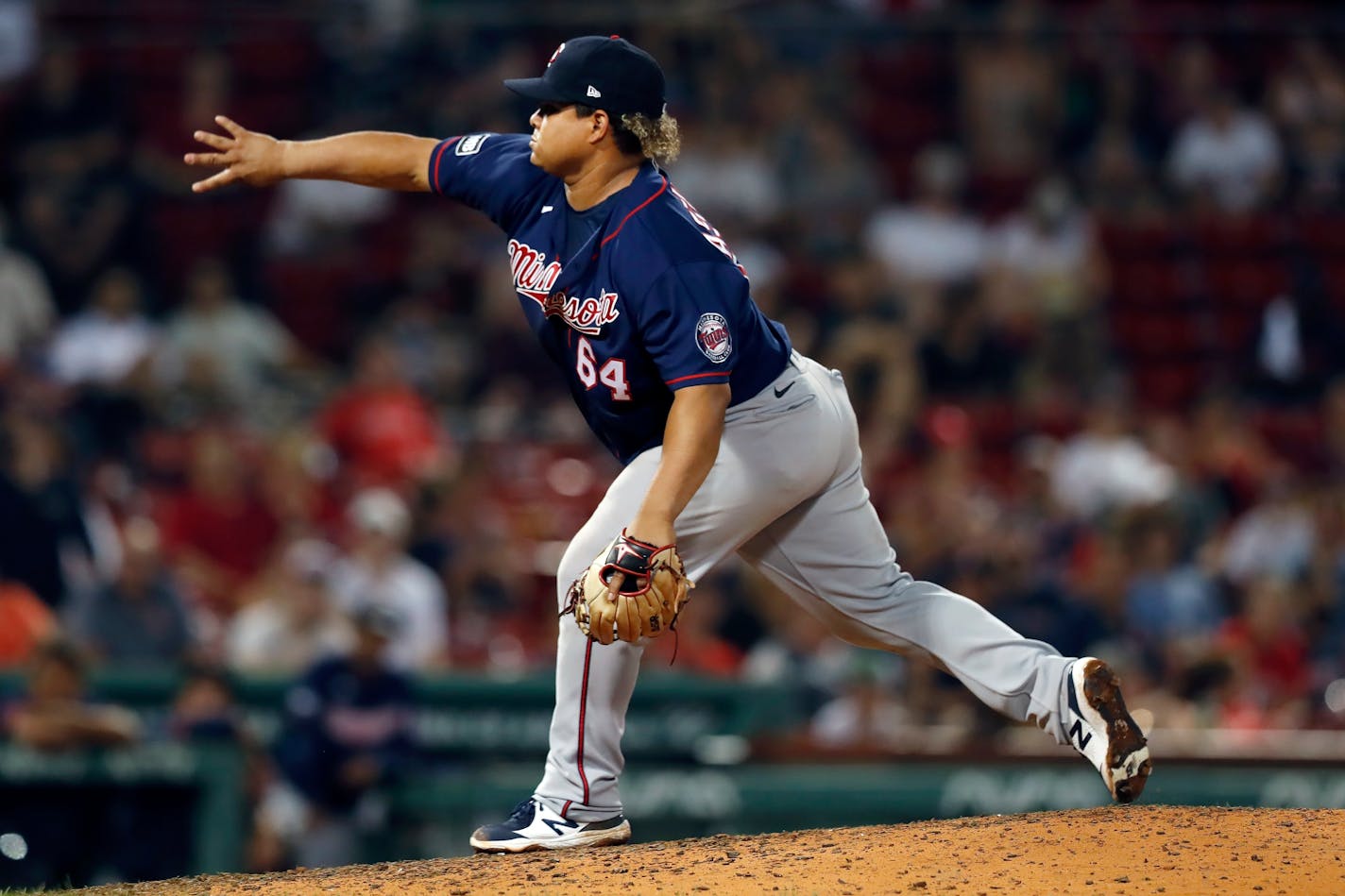 Minnesota Twins' Willians Astudillo pitches during the eighth inning of a baseball game against the Boston Red Sox, Thursday, Aug. 26, 2021, in Boston. (AP Photo/Michael Dwyer)