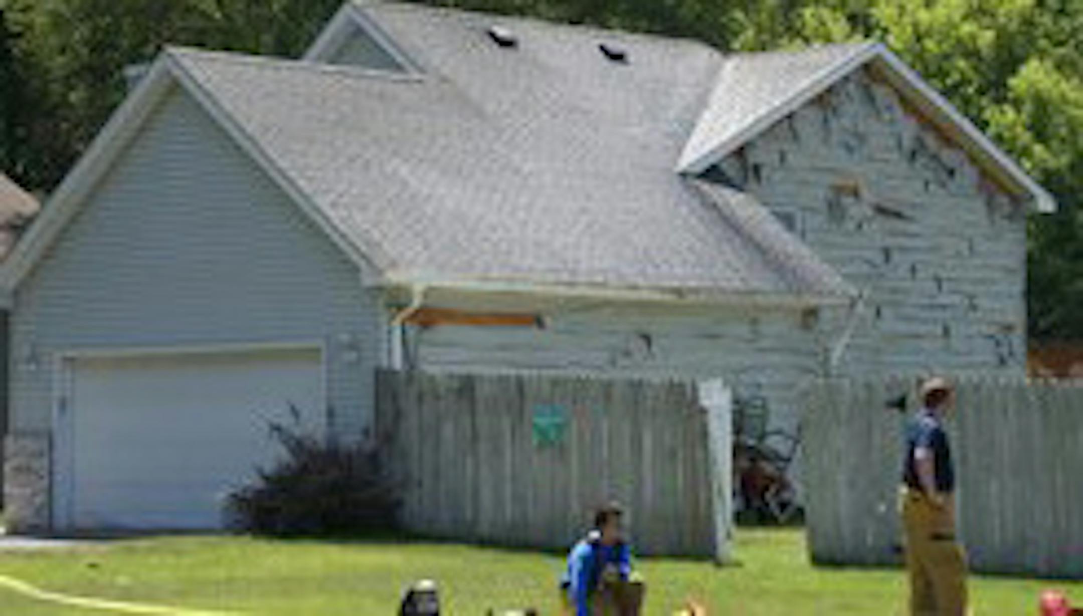 Heat from a fire training exercise in Brooklyn Park causes siding on a nearby house to peel.