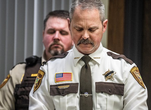 Pope County Sheriff Tim Riley reacts after the death of deputy Joshua Owen, Sunday, April 16, 2023, at a news conference in Glenwood, Minn.