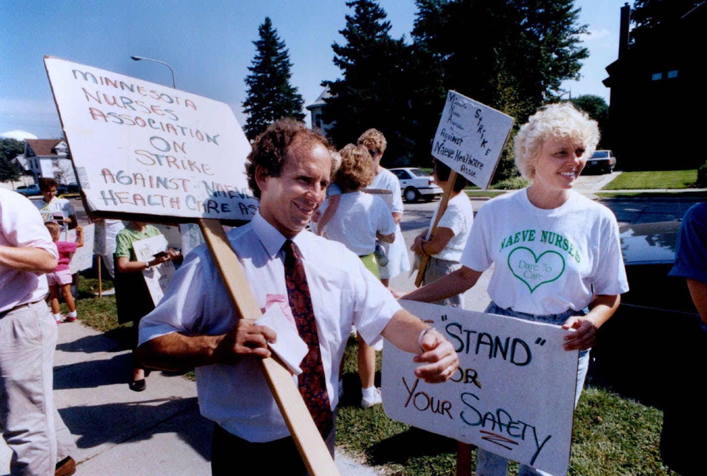 Paul Wellstone greeted striking nurses outside Naeve Hospital during a stop in Albert Lea, Minn on September 3, 1990. He's barnstorming the state and "giving 'em hell," reminiscent of Harry Truman.