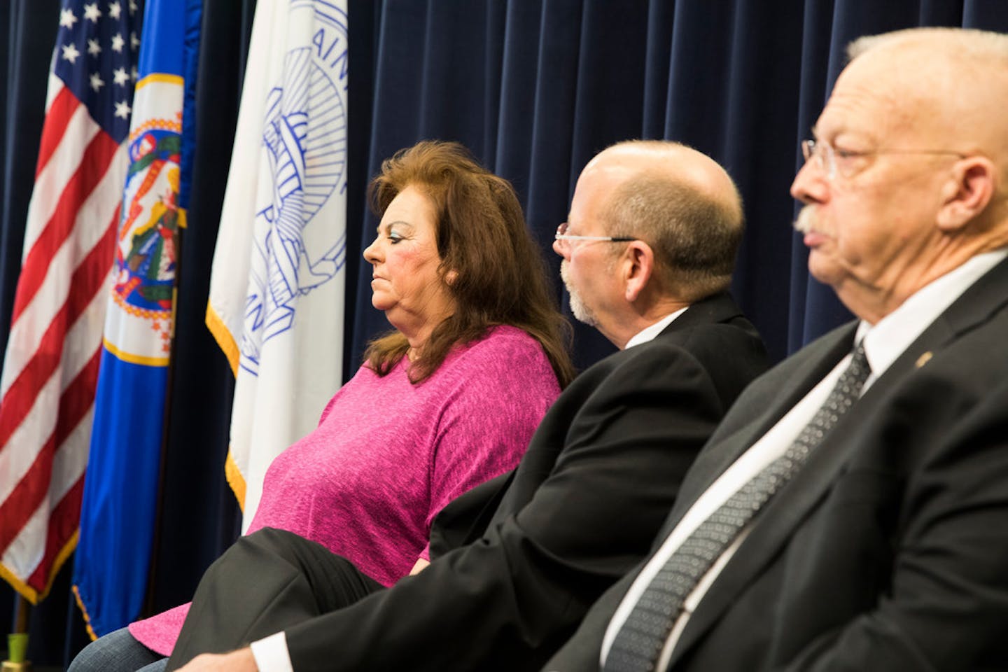 Dorothy Noga, the civilian who helped break the case, sits with retired St. Paul police officers Patrick Scott and Richard Klein on Wednesday as they were honored.