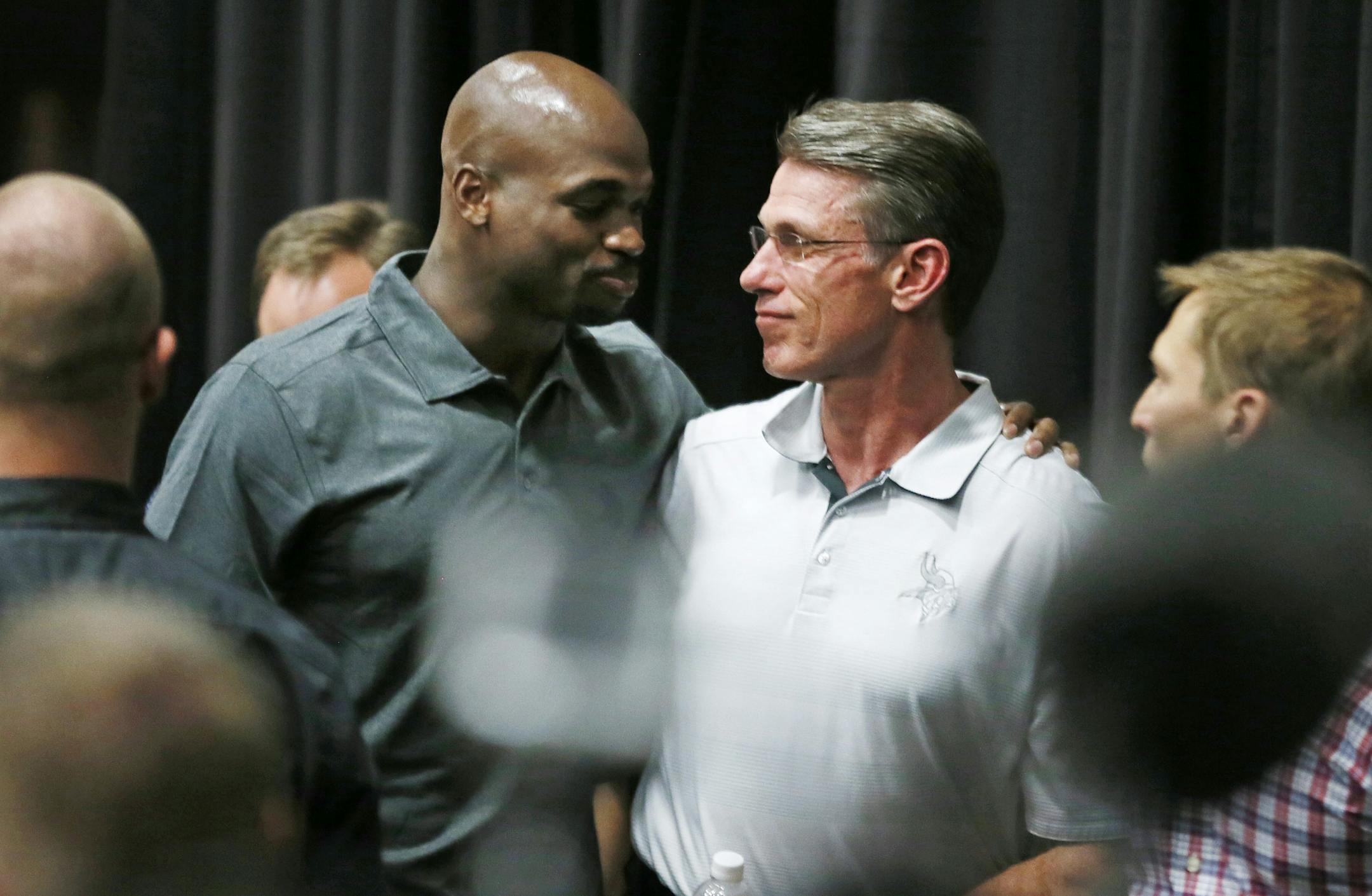 Viking running back Adrian Peterson hugged Vikings GM Rick Spielman after speaking to the media during a press conference at Winter Park Monday June 2, 2015 in Eden Prairie, MN.