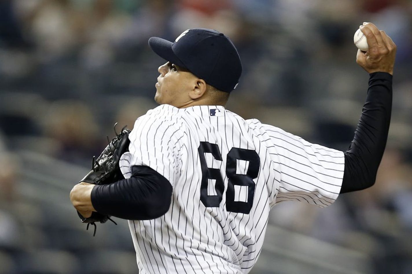 New York Yankees relief pitcher Dellin Betances delivers in a baseball game against the Oakland Athletics at Yankee Stadium in New York, Tuesday, June 3, 2014.