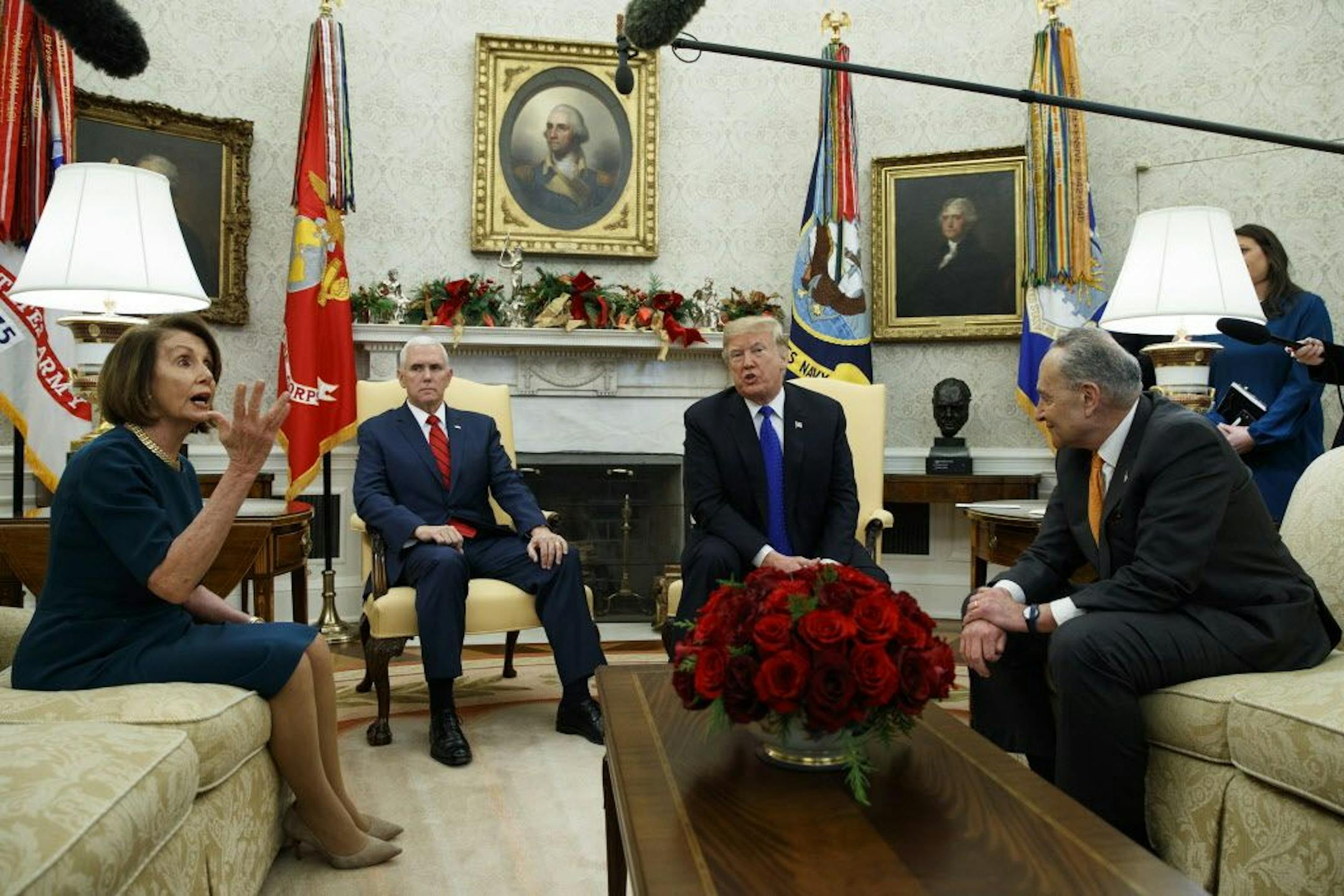 House Minority Leader Nancy Pelosi, D-Calif., Vice President Mike Pence, President Donald Trump, and Senate Minority Leader Chuck Schumer, D-N.Y., argue during a meeting in the Oval Office of the White House, Tuesday, Dec. 11, 2018, in Washington.