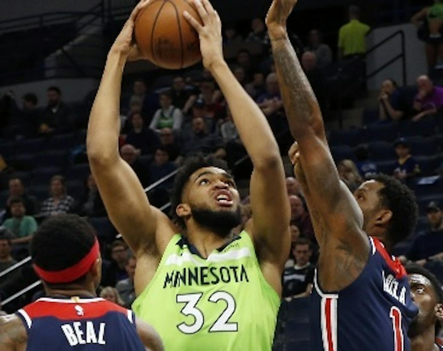 Wolves center Karl-Anthony Towns had 40 points and 16 rebounds against the Wizards on Saturday night, but missed the end of the fourth quarter and overtime in Minnesota's 135-130 victory because of a right knee injury not believed to be serious.