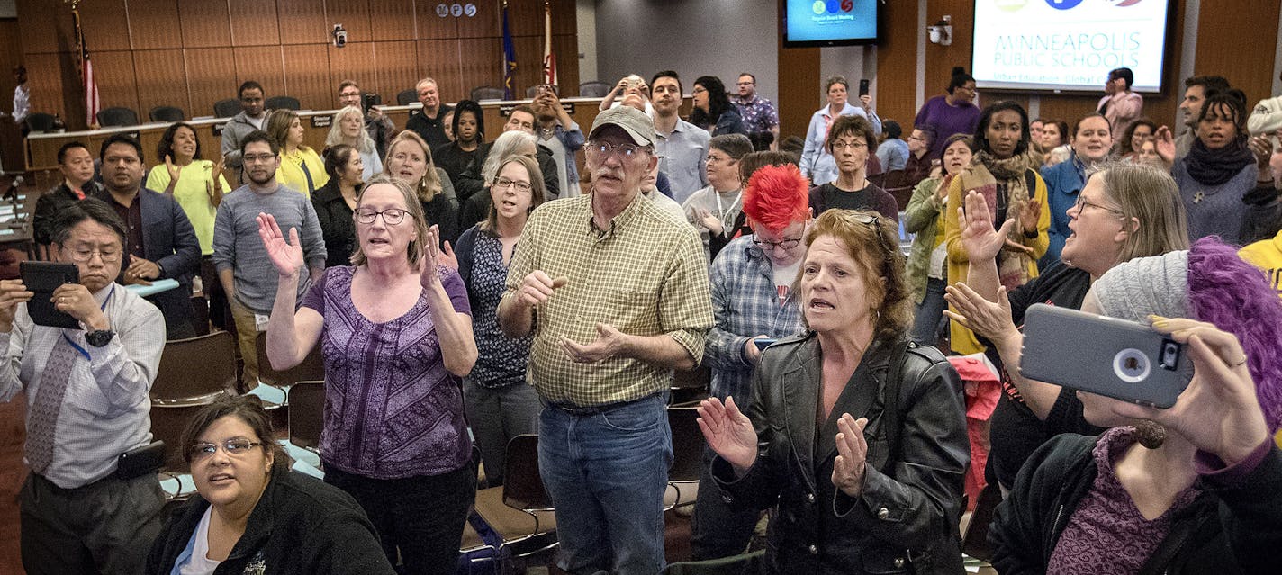 Some attendees chanted "Let them in" for a group that was initially barred from entering the meeting room because of overcapacity before the start of a Minneapolis school board meeting at the John B. Davis Education and Service Center. ] CARLOS GONZALEZ &#xef; cgonzalez@startribune.com - April 18, 2017, Minneapolis, MN, outrage over Minneapolis Public School board cuts. Protest at School Board Meeting. ORG XMIT: MIN1704181849031923