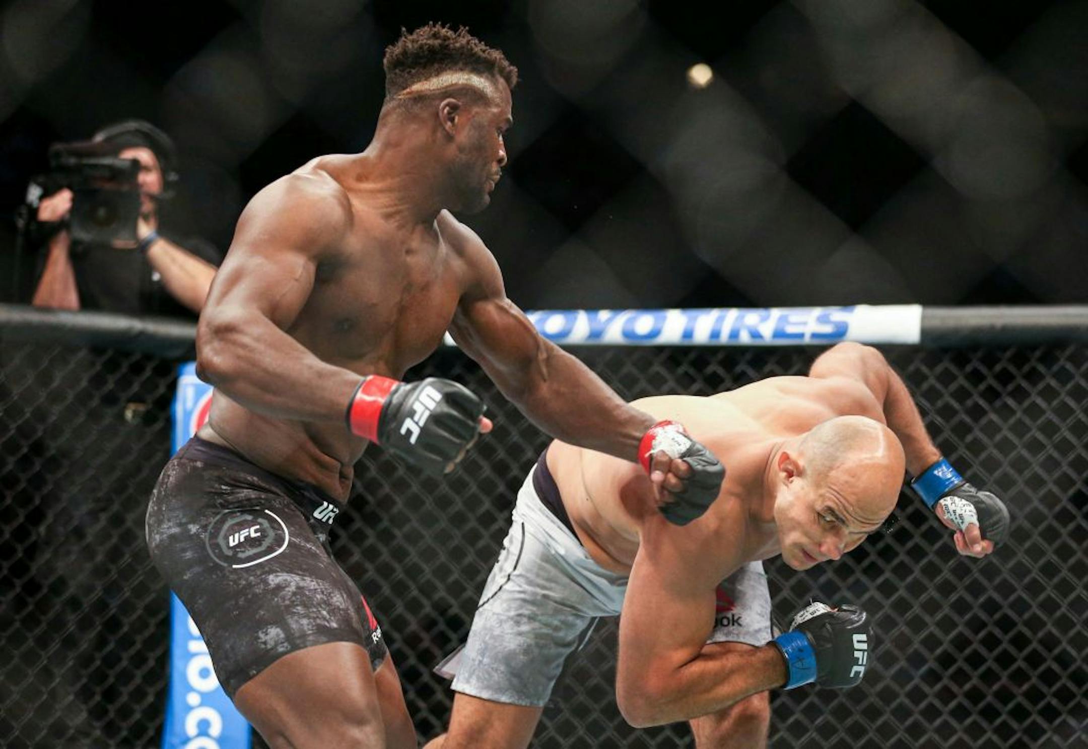 Francis Ngannou lands a decisive and heavy punch on former UFC heavyweight champion Junior Dos Santos. Ngannou won the bout with an early first round TKO. ALEX KORMANN ¥ alex.kormann@startribune.com UFC Fight Night was held at Target Center on Saturday June 29, 2019. Francis Ngannou and Junior Dos Santos headlined the event.