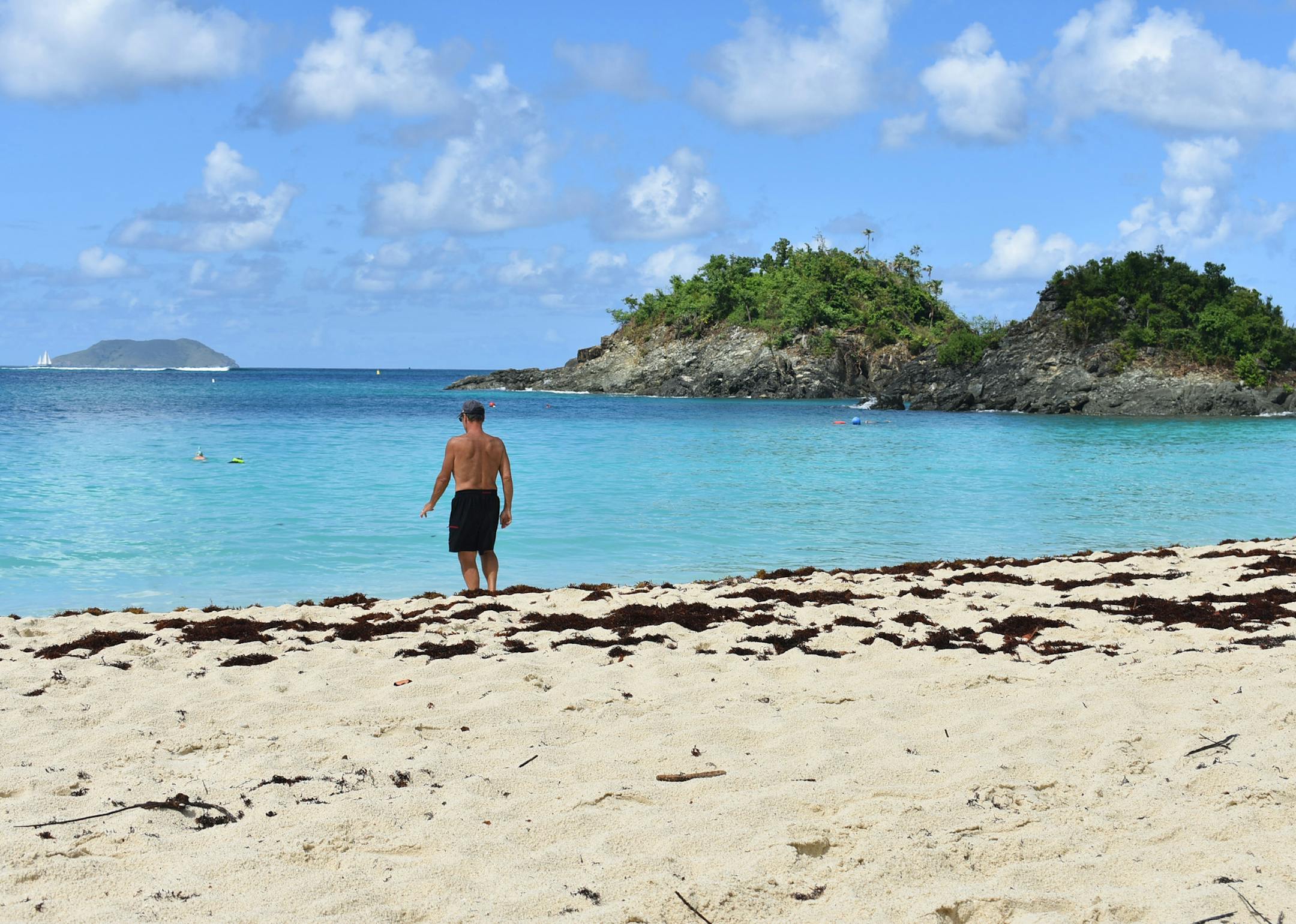 A swimmer enters the water at Trunk Bay, home to the Underwater Trail in the Virgin Islands National Park. Photo by Claire Shefchik * Special to the Star Tribune