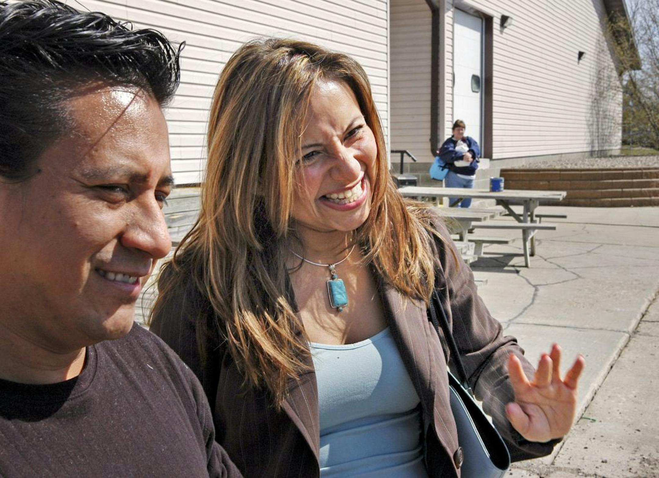 Glen Stubbe/Star Tribune Tuesday, May 3, 2005 � Blackduck, Minn. � At the end of the day�s shift, Doris Ruiz waves to some of the Latino workers she helped place into jobs at Anderson Fabrics in Blackduck. With her on the left is Roberto Rivera who moved several members of his family to northern Minnesota,