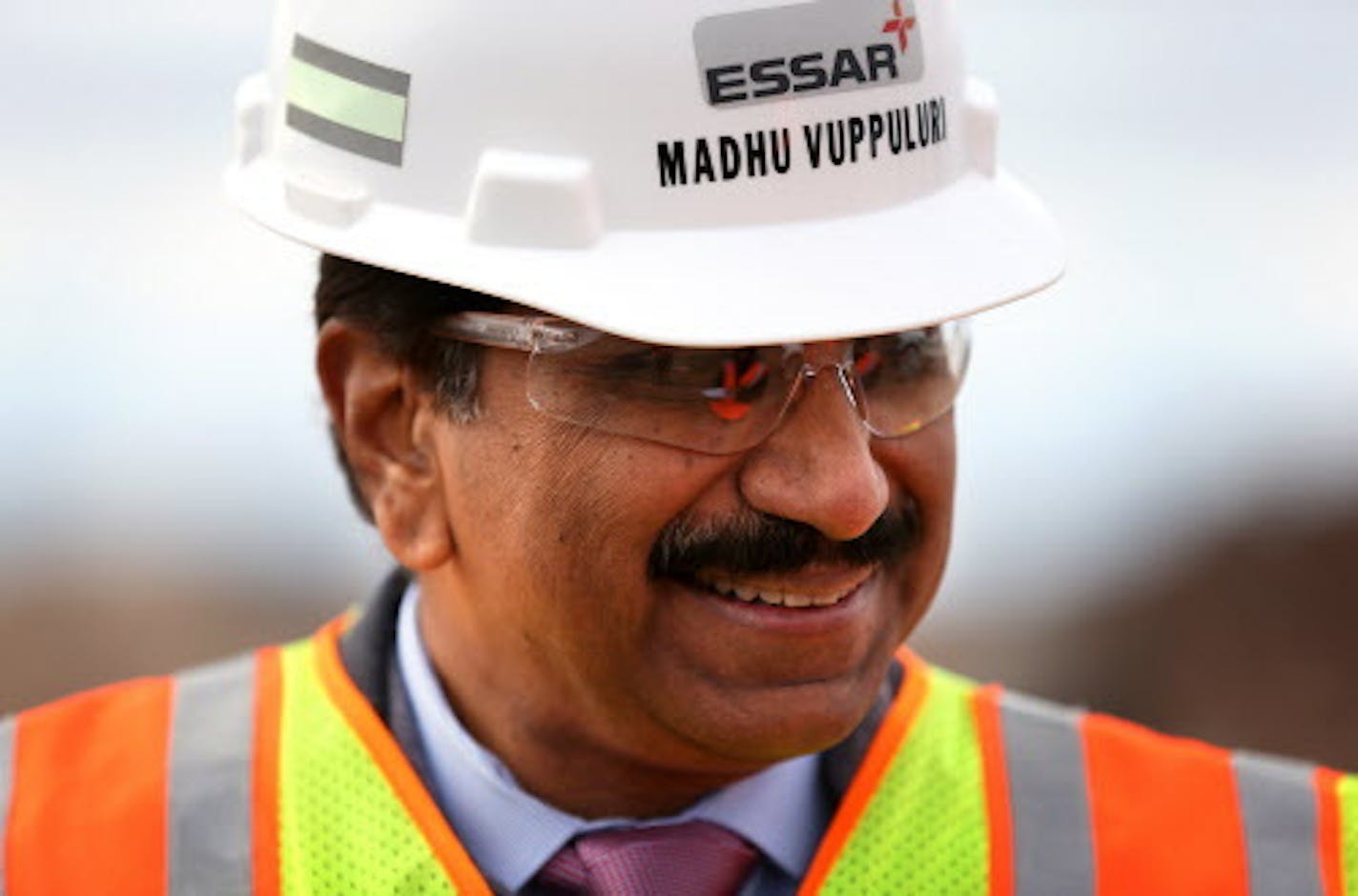 Madhu Vuppuluri, president and CEO of Essar Steel Minnesota, looks over the Essar Project in Nashwauk, Minn. Essar Steel Minnesota recently ramped up construction on an $1.8 billion taconite plant after securing the funding needed to complete the project. ] LEILA NAVIDI leila.navidi@startribune.com / BACKGROUND INFORMATION: Thursday, October 30, 2014. The plant endured several delays over the past two years as funds periodically ran dry and some contractors were paid late and walked off the job.