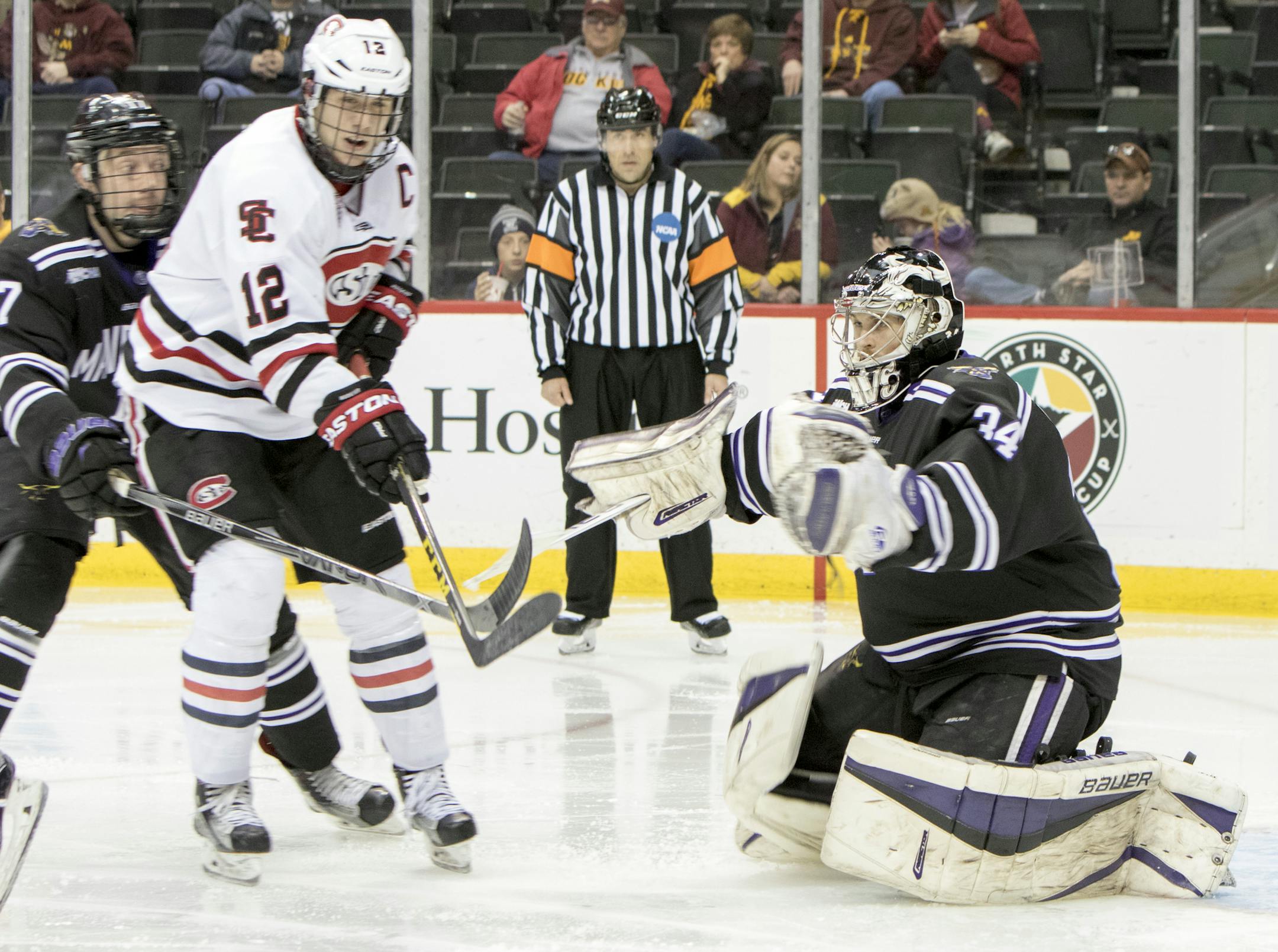 St. Cloud State Huskies defenseman Ethan Prow (12) cannot pull the trigger as the St. Cloud State Huskies faced off against the Minnesota State University Mavericks in the 2016 North Star College Cup tournament semi finals on January 30, 2016 at the Xcel Energy Center in St. Paul, Minnesota. ] Special to Star Tribune MATT BLEWETT ï matt@mattebphoto.com - January 30, 2016, St. Paul, Minnesota, St. Cloud State Huskies, Minnesota State University Mavericks, 2016 North Star College Cup, 213971