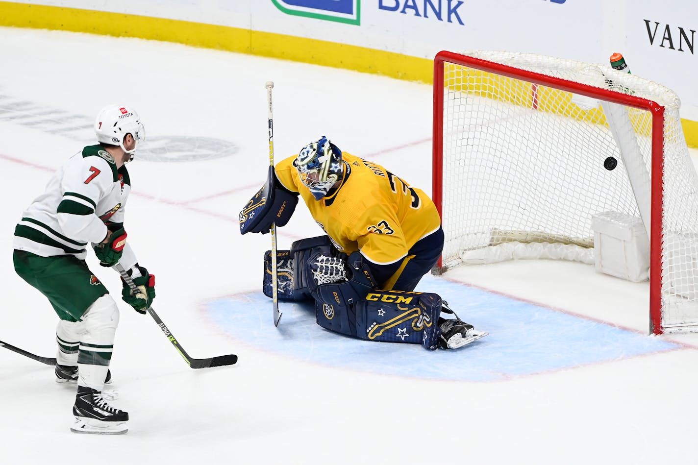 Minnesota Wild defenseman Dmitry Kulikov (7) scores a goal against Nashville Predators goaltender David Rittich (33) in overtime of an NHL hockey game Sunday, April 24, 2022, in Nashville, Tenn. (AP Photo/Mark Zaleski)