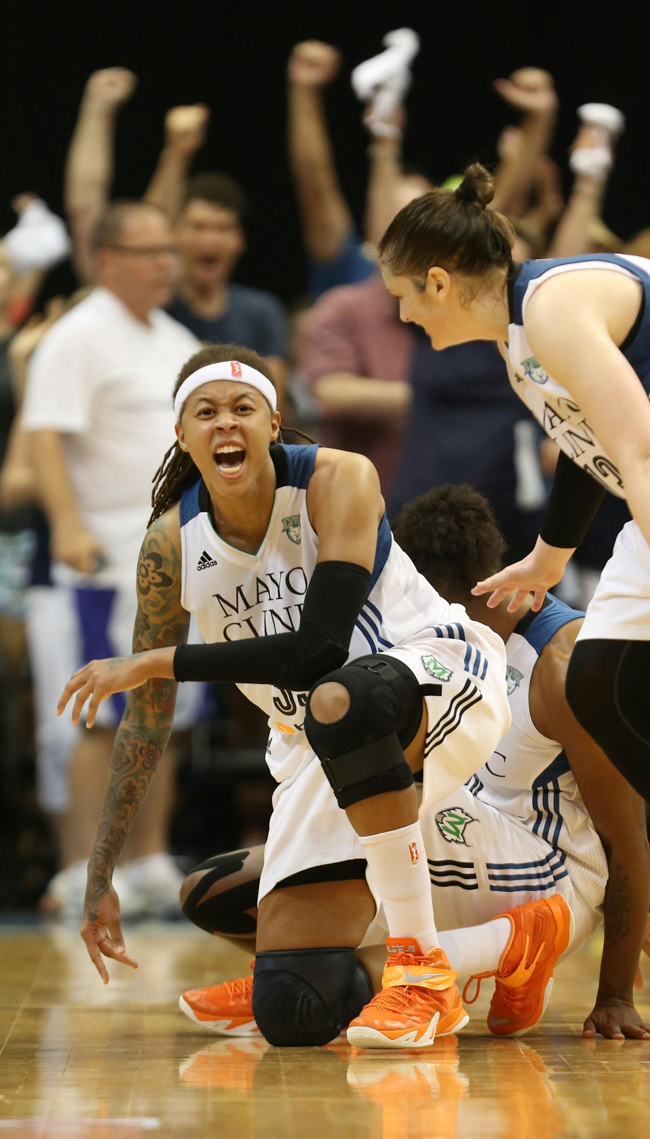 Lynx Seimone Augustus celebrated after being fouled to the floor and tying the game during second half action. ] (KYNDELL HARKNESS/STAR TRIBUNE) kyndell.harkness@startribune.com Second game of the Western conference finals Lynx vs Phoenix at the Target center in Minneapolis Min., Sunday, August, 31, 2014. Lynx won 82-77.