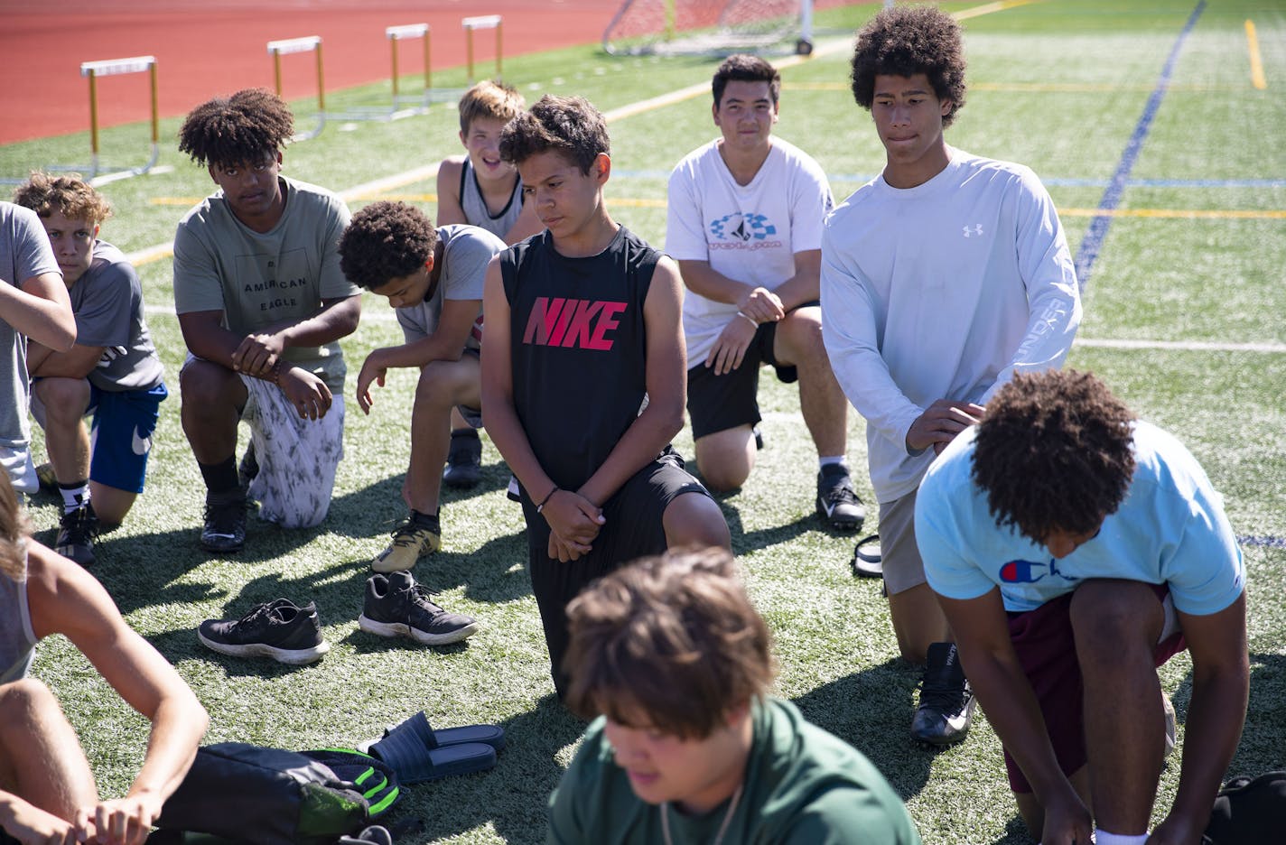 Denfeld football players reacted as they listened to head coach Erik Lofald talk to the team about the MSHSL decision to move football to the spring.