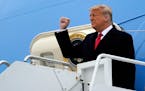 President Donald Trump gestures as he steps off Air Force One upon arrival at Valley International Airport, Tuesday, Jan. 12, 2021, in Harlingen, Texa