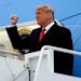 President Donald Trump gestures as he steps off Air Force One upon arrival at Valley International Airport, Tuesday, Jan. 12, 2021, in Harlingen, Texa