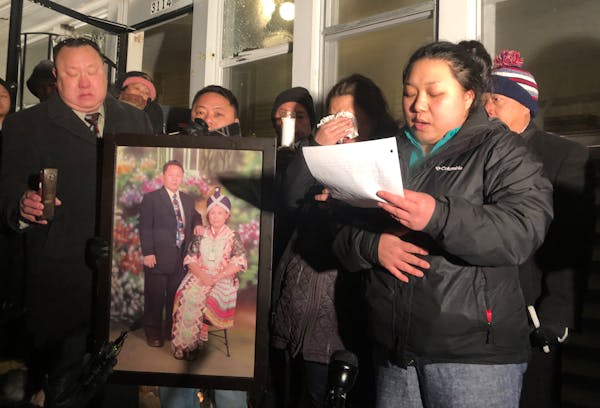 ChaMee Vue tearfully addressed relatives and friends during a candlelight vigil outside her family’s home on Dec. 17, 2019, held in honor of her fat