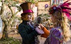 This image released by Disney shows Johnny Depp as the Mad Hatter, left, and Mia Wasikowska as Alice in a scene from "Alice Through the Looking Glass,