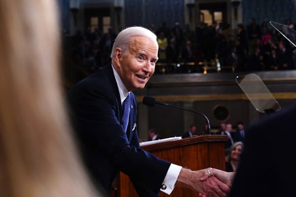 President Joe Biden shakes hands after delivering the State of the Union address to a joint session of Congress at the Capitol, Thursday, March 7, 202