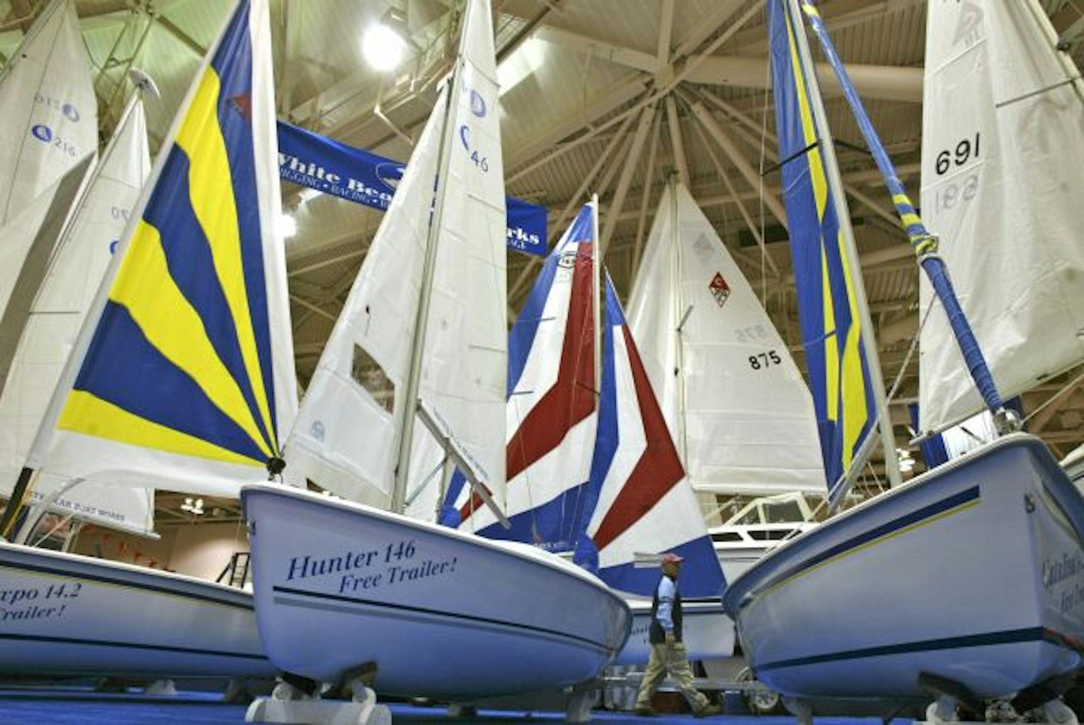 BRUCE BISPING � bbisping@startribune.com Bruce Bisping/Star Tribune. Minneapolis, MN., Thursday, 1/19/2006. Sailboat masts reached to the roof at the White Bear Boat Works display at the 34th Annual Boat Show at the Minneapolis Convention Center. The show runs through January 22nd and features six hundred boats from over 200 exhibitors ranging from canoes to ocean cruisers.