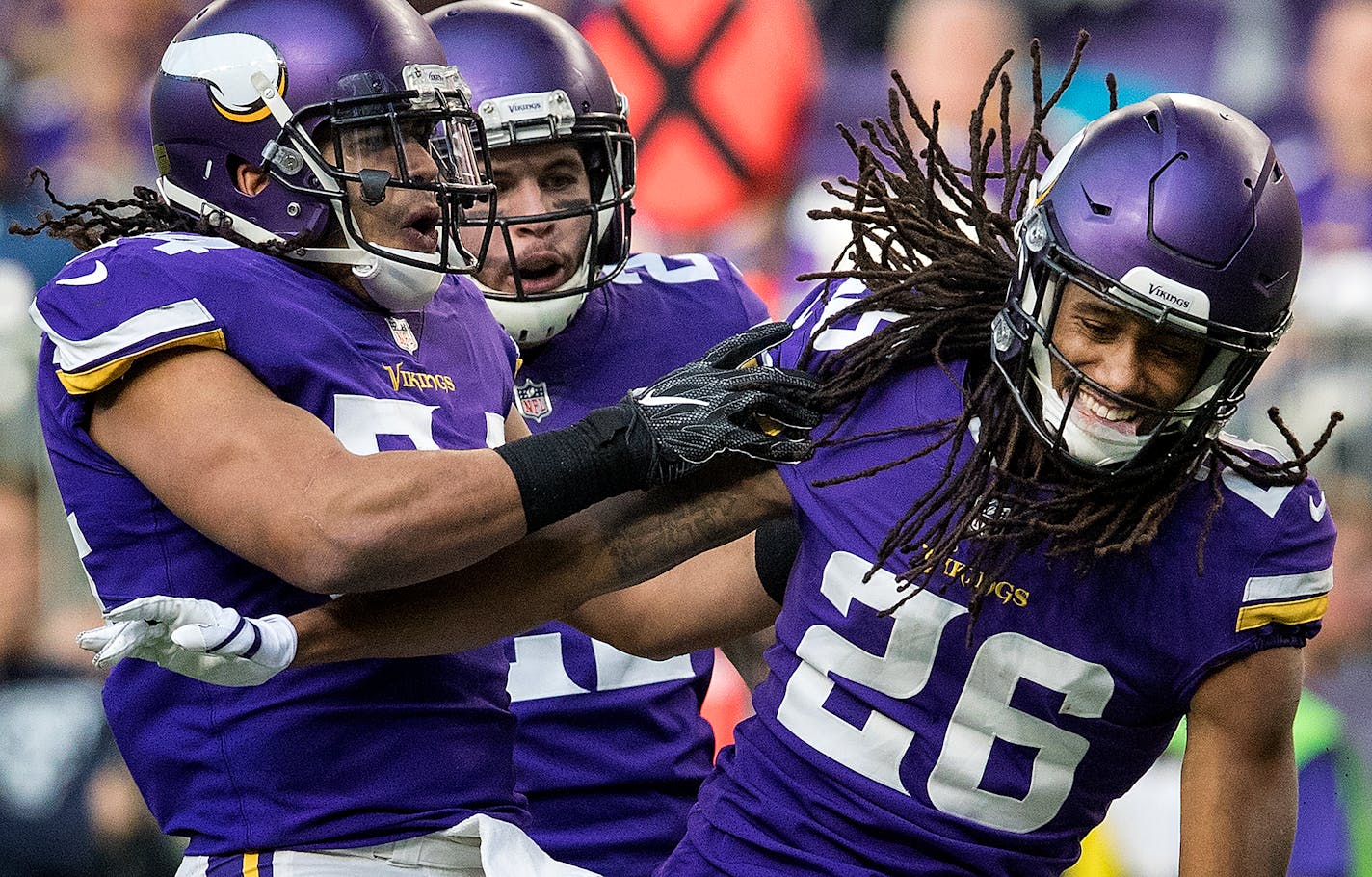 Eric Kendricks (54) celebrated with Trae Waynes (26) after a tackle in the third quarter.