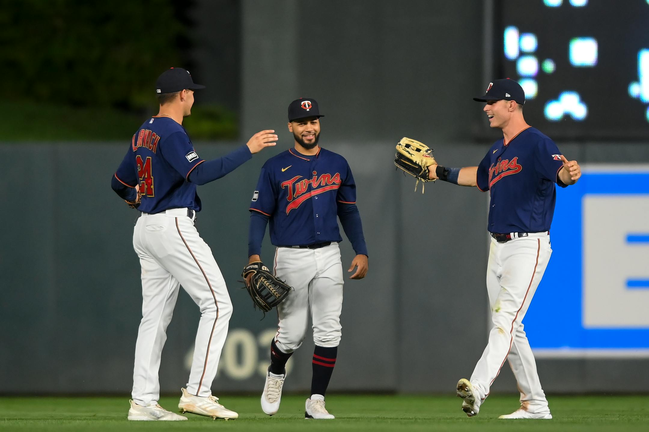 From left, Minnesota Twins right fielder Trevor Larnach (24), center fielder Gilberto Celestino (79) and center fielder Max Kepler (26) celebrated their team's 5-3 win against the Detroit Tigers Thursday night.