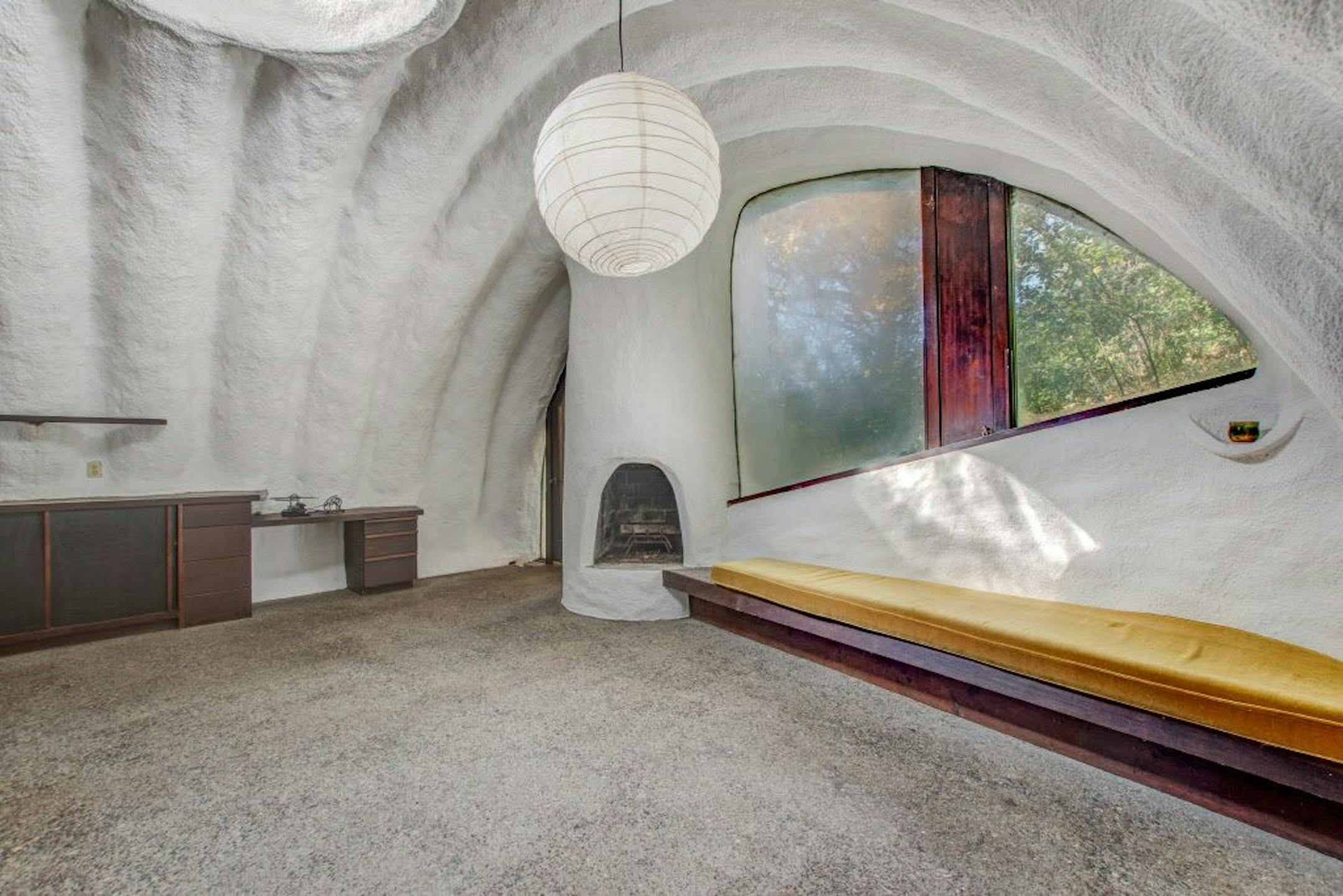 One of two bedroom suites with a fireplace and built-in sitting area.