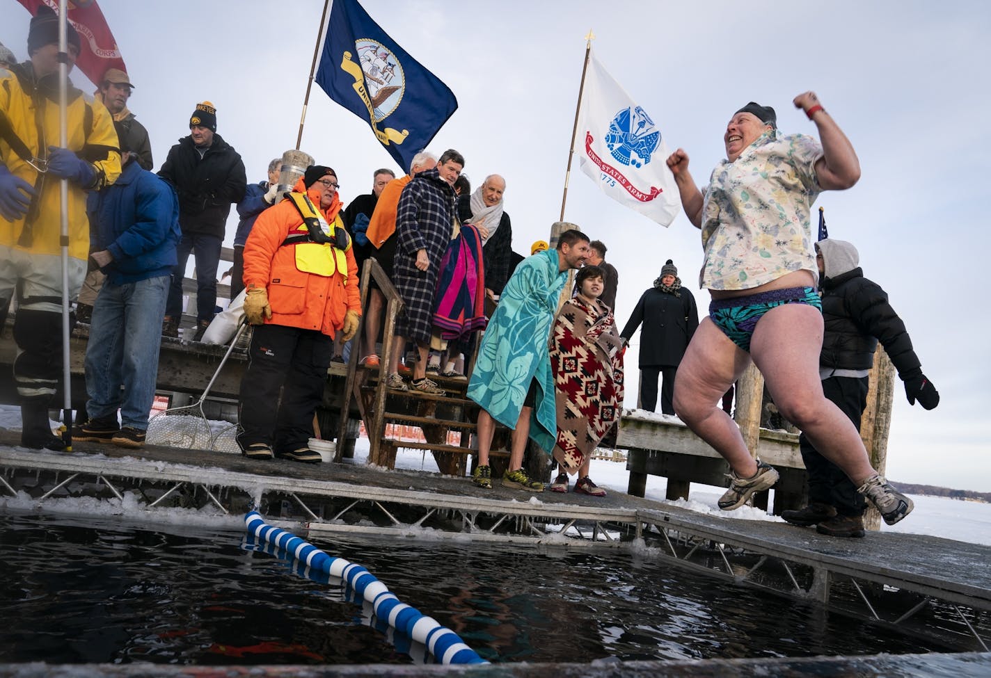 Ann Maresh of West St. Paul, who said she wore a tropical shirt for the warm weather, participated in her tenth dive and achieved shark status, during the ALARC Ice Dive.