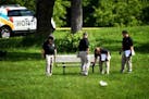 BCA officials investigate the scene of an officer-involved shooting in Bassett Creek Park in Crystal on Wednesday.