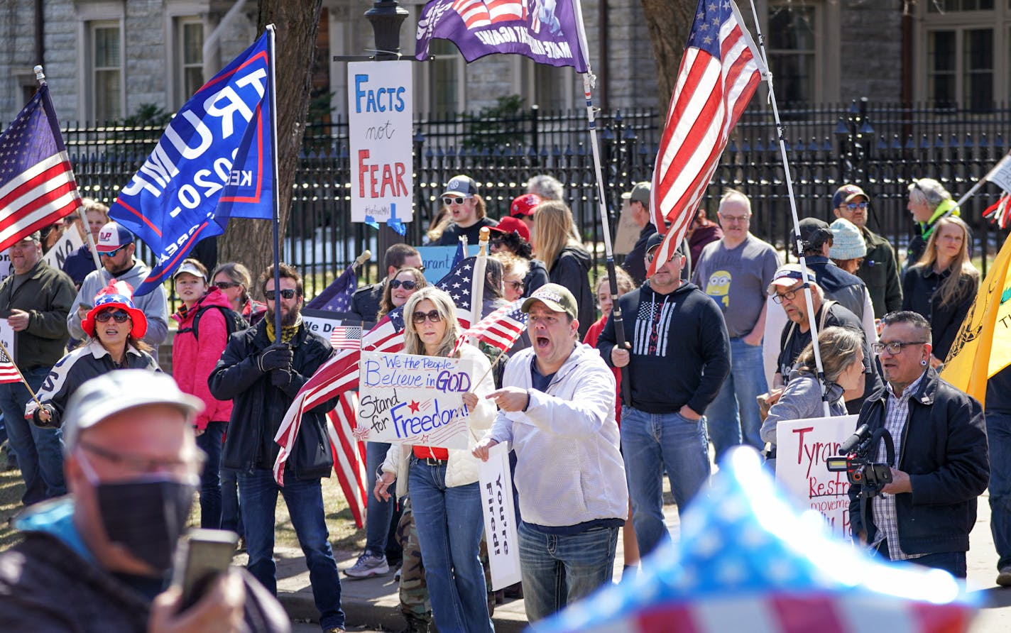 Hundreds of protesters gathered outside the Minnesota governor's residence Friday to protest the "stay home" order.