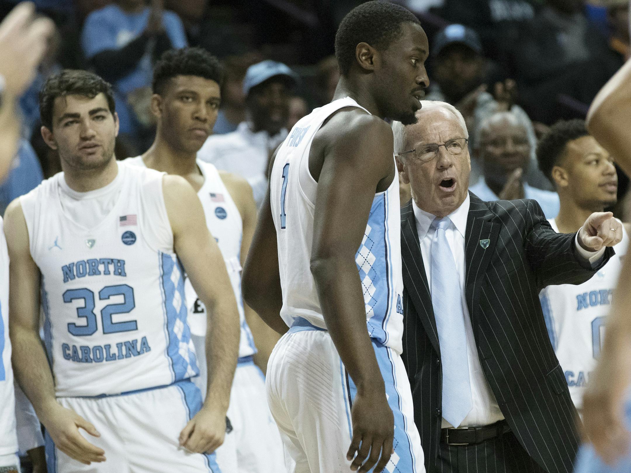 North Carolina head coach Roy Williams, right, gives forward Theo Pinson (1) instruction during the second half of an NCAA college basketball game against the Miami in the Atlantic Coast Conference tournament, Thursday, March 9, 2017, in New York. North Carolina won 78-53. (AP Photo/Mary Altaffer)