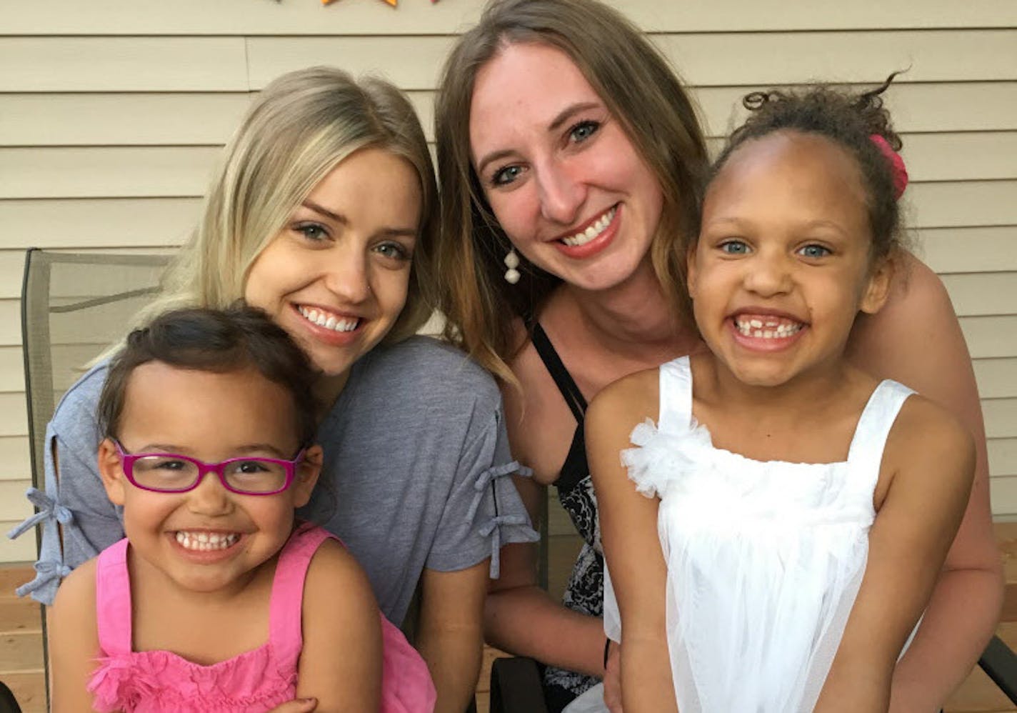 Anagret and Kyrkja Rydland with their birth mothers Greta Guldseth and Jenna Yentsch.