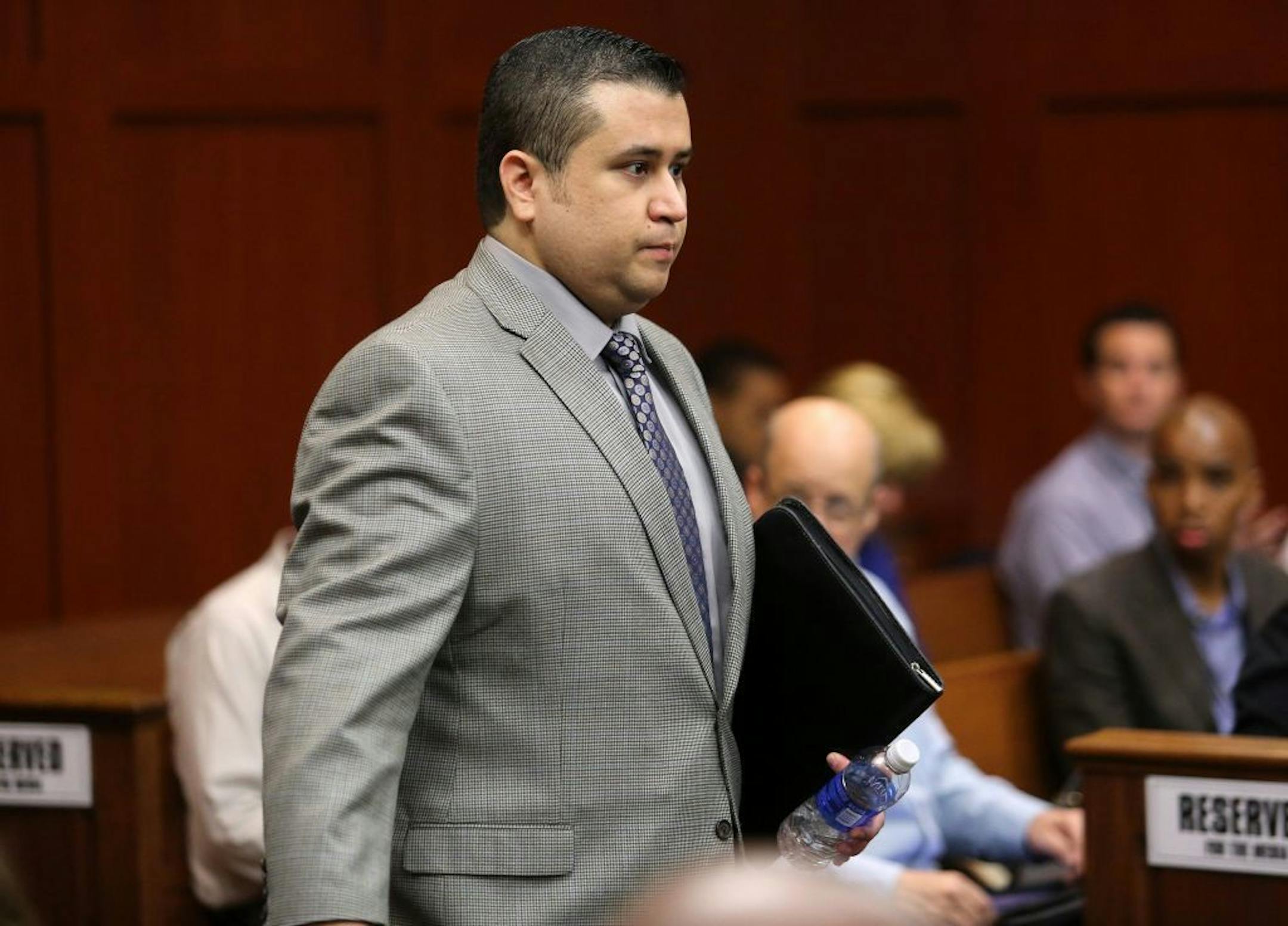 George Zimmerman arrives for the 17th day of his trial in Seminole circuit court, in Sanford, Florida, Tuesday, July 2, 2013. Zimmerman is charged with second-degree murder in the fatal shooting of Trayvon Martin in 2012.