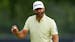 Dustin Johnson waves after making a putt on the 17th hole during the second round of the PGA Championship golf tournament at Southern Hills Country Cl