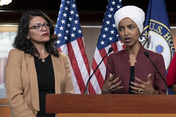 FILE - In this July 15, 2019, file photo, U.S. Rep. Ilhan Omar, D-Minn, right, speaks, as U.S. Rep. Rashida Tlaib, D-Mich. listens, during a news conf